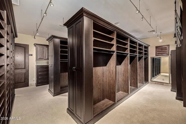 an aerial view of residential houses with outdoor space and swimming pool