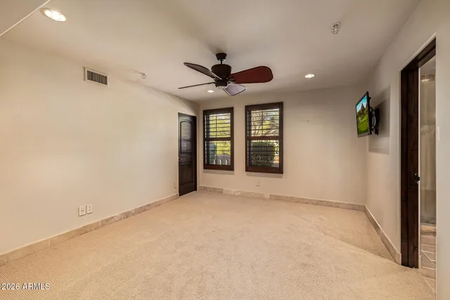 a view of a lake with houses in the back
