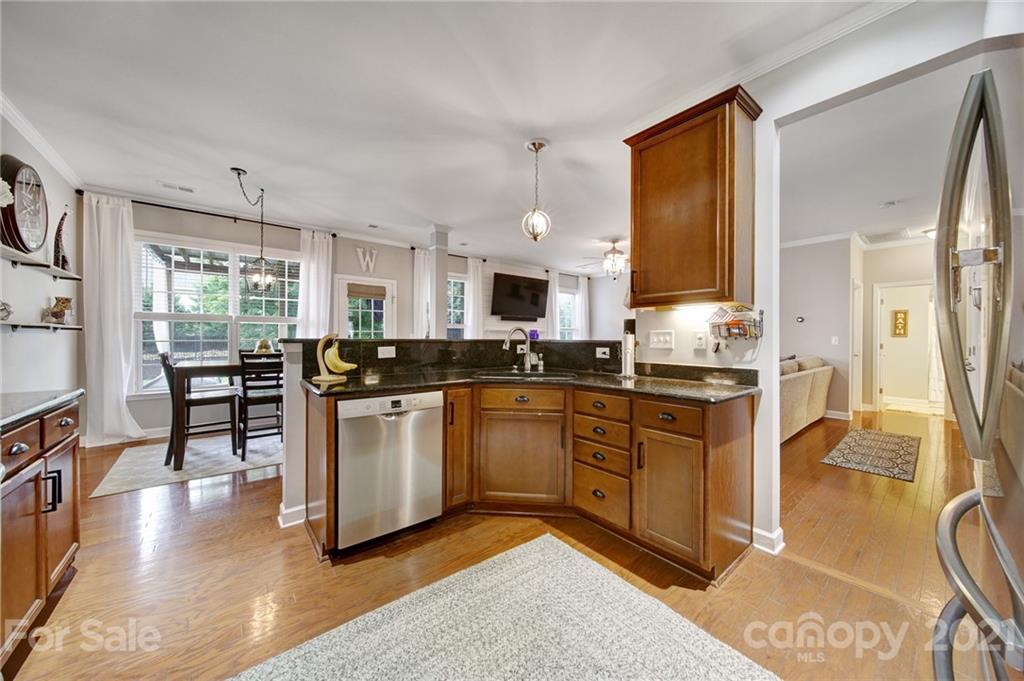 823 Solandra Way Tega Cay, SC 29708 - Photo 11 of 43 a kitchen with sink and cabinets
