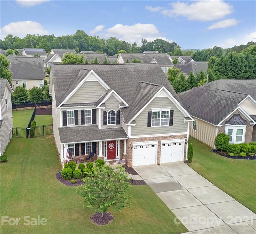 823 Solandra Way Tega Cay, SC 29708 - Photo 3 of 43 a aerial view of a house with a yard