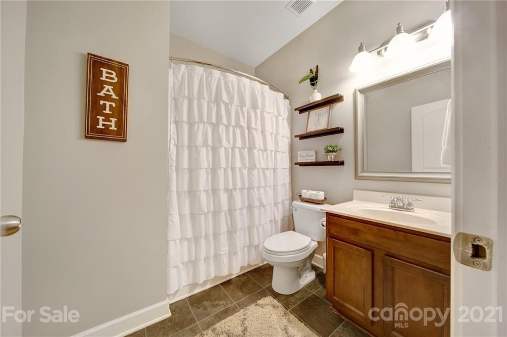 823 Solandra Way Tega Cay, SC 29708 - Photo 21 of 43 a bathroom with a sink toilet and shower