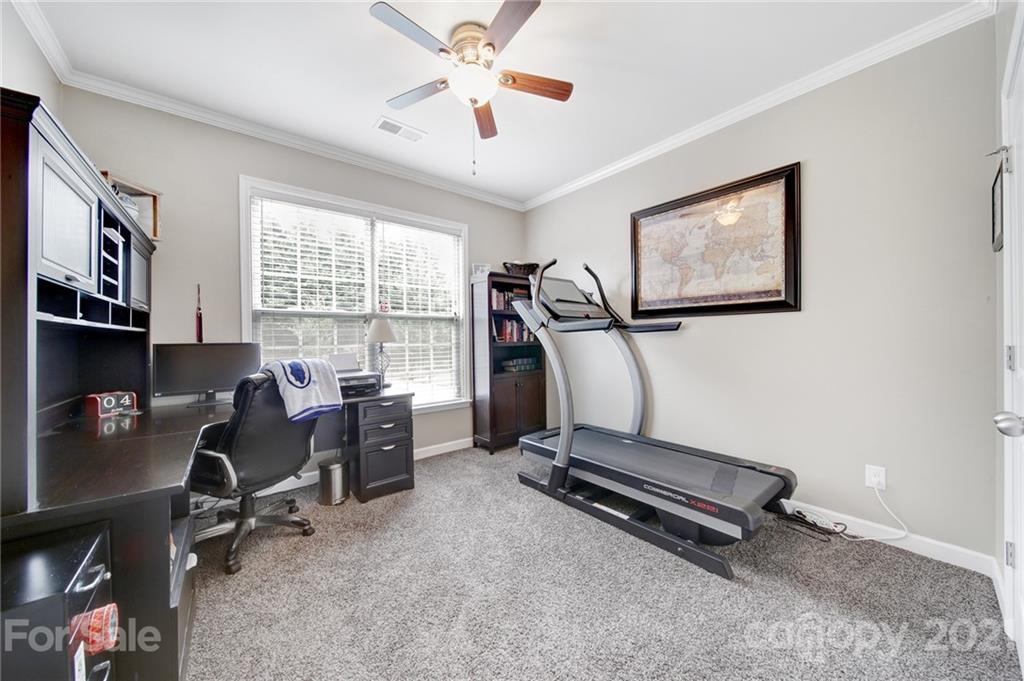 823 Solandra Way Tega Cay, SC 29708 - Photo 22 of 43 a view of a workspace with furniture and a window