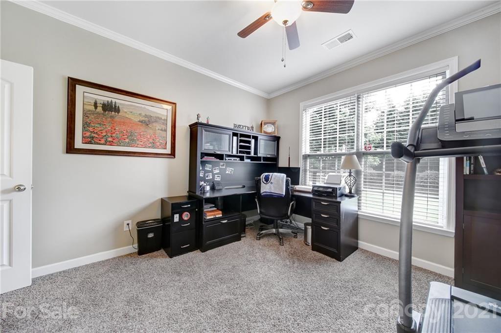 823 Solandra Way Tega Cay, SC 29708 - Photo 23 of 43 a view of a workspace with furniture and a window