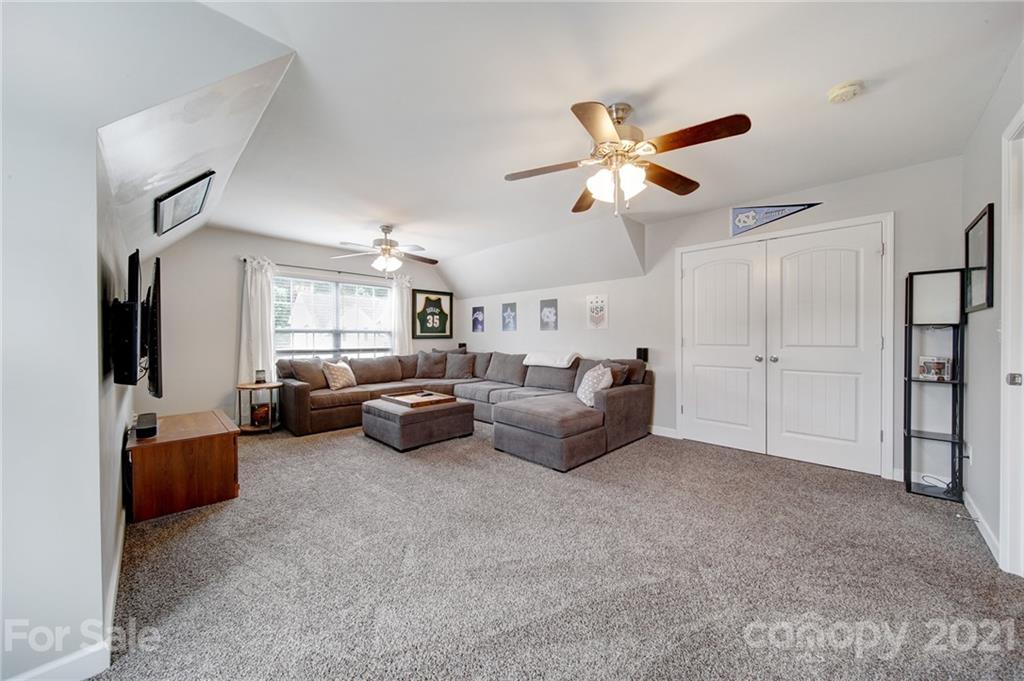 823 Solandra Way Tega Cay, SC 29708 - Photo 26 of 43 a living room with furniture and a ceiling fan