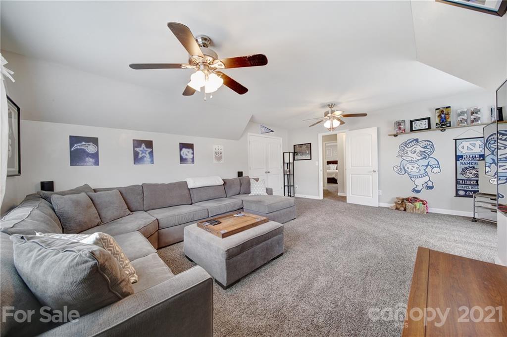 823 Solandra Way Tega Cay, SC 29708 - Photo 27 of 43 a living room with furniture and white walls