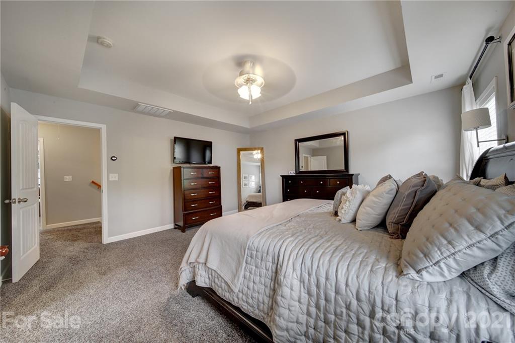 823 Solandra Way Tega Cay, SC 29708 - Photo 31 of 43 a bedroom with a bed and a tv