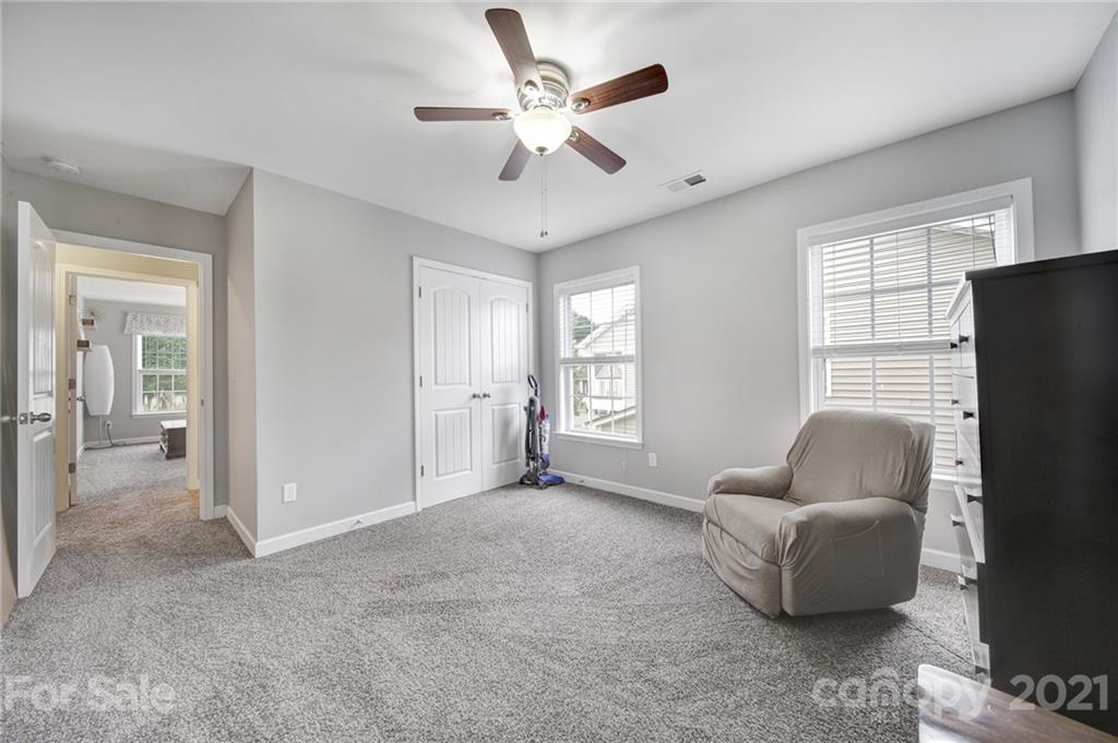 823 Solandra Way Tega Cay, SC 29708 - Photo 34 of 43 a living room with furniture and a window