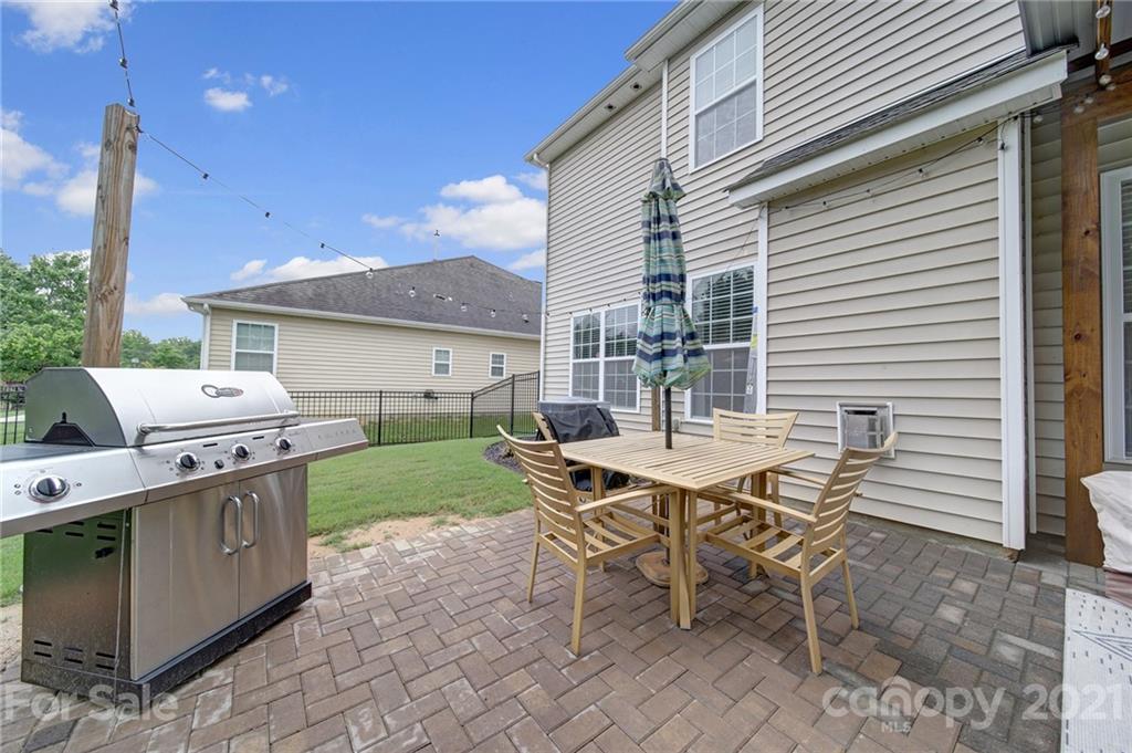 823 Solandra Way Tega Cay, SC 29708 - Photo 40 of 43 a patio with table and chairs