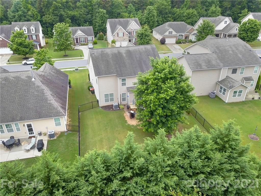 823 Solandra Way Tega Cay, SC 29708 - Photo 5 of 43 an aerial view of a house with garden space and a street view