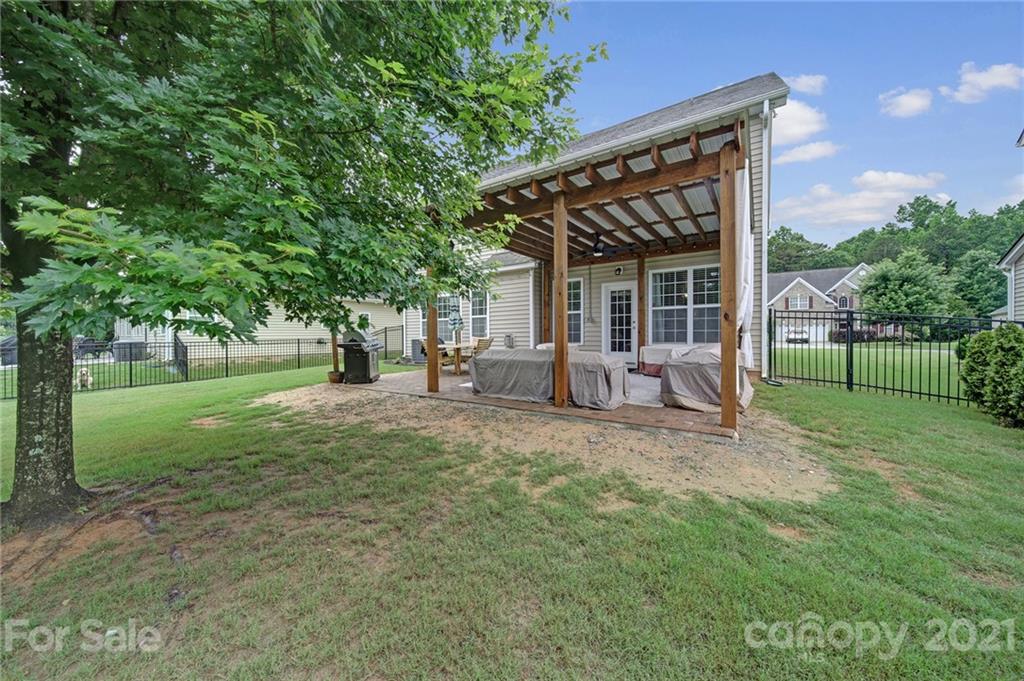 823 Solandra Way Tega Cay, SC 29708 - Photo 42 of 43 a view of a house with backyard and trees