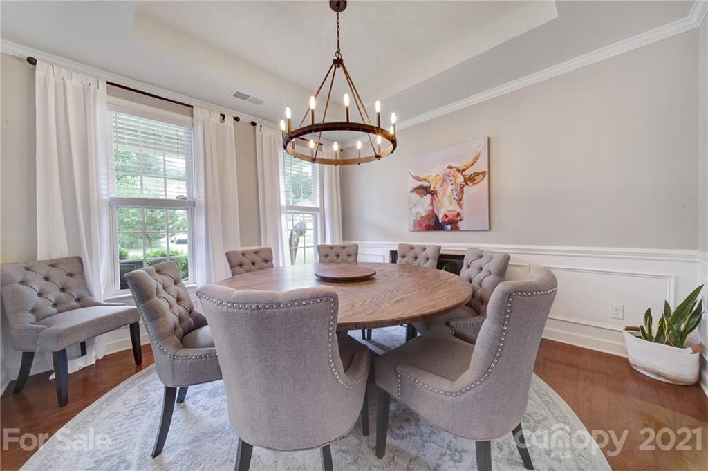 823 Solandra Way Tega Cay, SC 29708 - Photo 8 of 43 a view of a dining room with furniture window and outside view