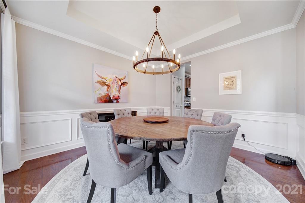 823 Solandra Way Tega Cay, SC 29708 - Photo 10 of 43 a view of a dining room with furniture window and wooden floor