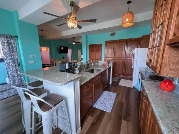 a dining room with furniture and wooden floor