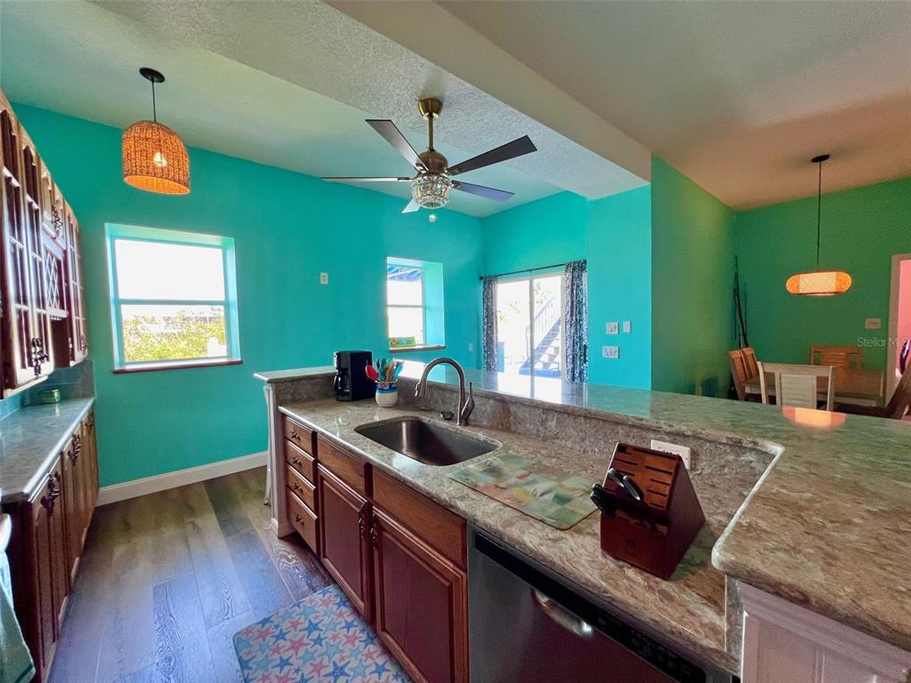 9594 Doubloon Trail Placida, FL 33946 - Photo 20 of 84 a kitchen with a sink and a stove top oven