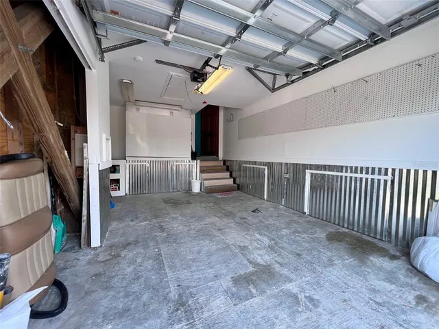 a bathroom with a sink mirror and a bath tub