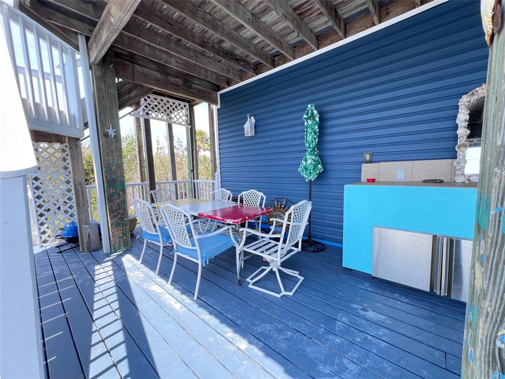 9594 Doubloon Trail Placida, FL 33946 - Photo 32 of 84 a dining room with furniture and wooden floor