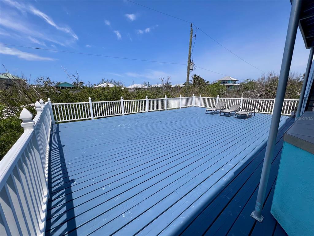 9594 Doubloon Trail Placida, FL 33946 - Photo 37 of 84 a view of a balcony with wooden floor and city view
