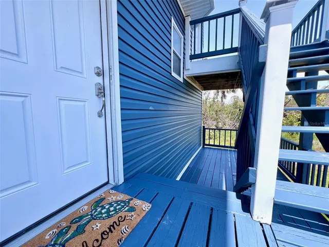 a kitchen with stainless steel appliances granite countertop a refrigerator a stove top oven a sink and dishwasher