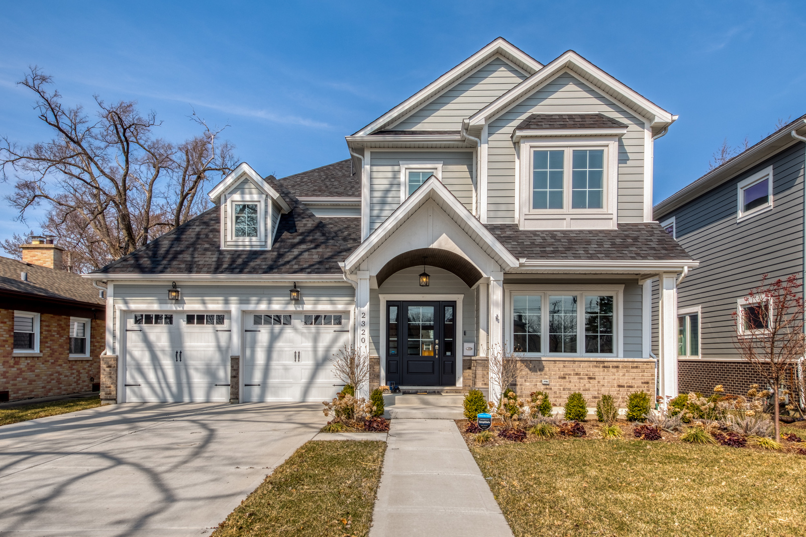 a front view of a house with a yard