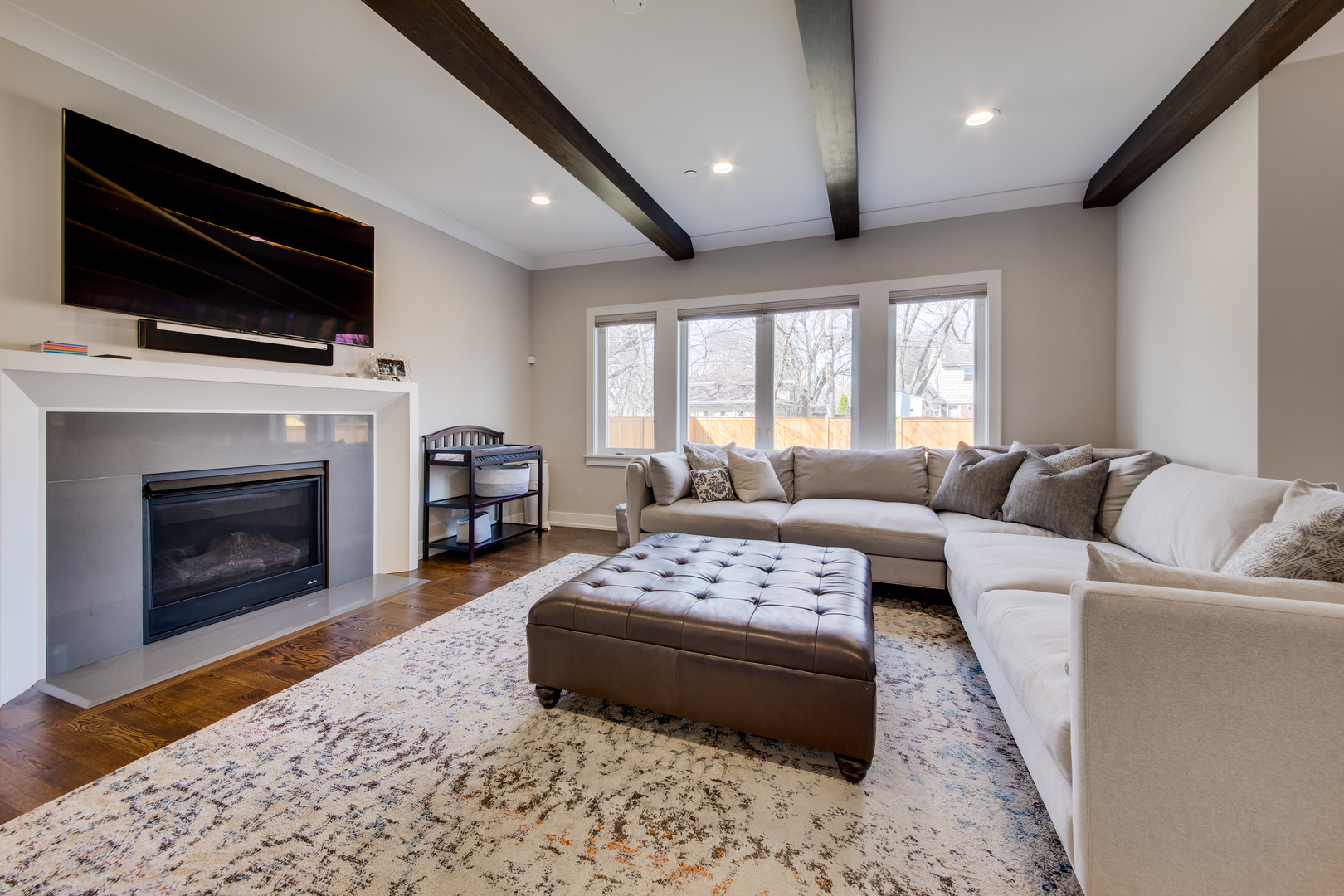 2320 Edna Avenue Park Ridge, IL 60068 - Photo 14 of 41 a living room with furniture a flat screen tv and a fireplace