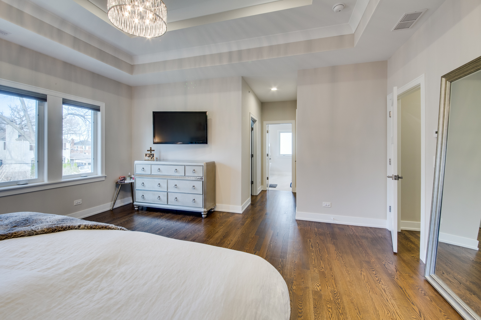 2320 Edna Avenue Park Ridge, IL 60068 - Photo 20 of 41 a spacious bedroom with a bed and a flat screen tv