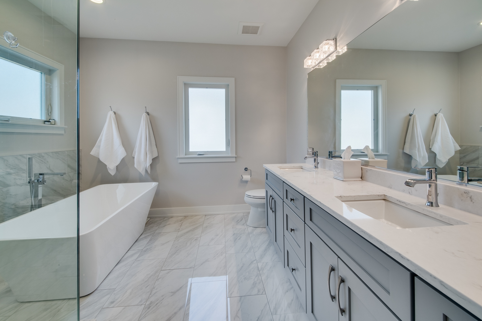 2320 Edna Avenue Park Ridge, IL 60068 - Photo 22 of 41 a bathroom with a double vanity sink a mirror and a bathtub