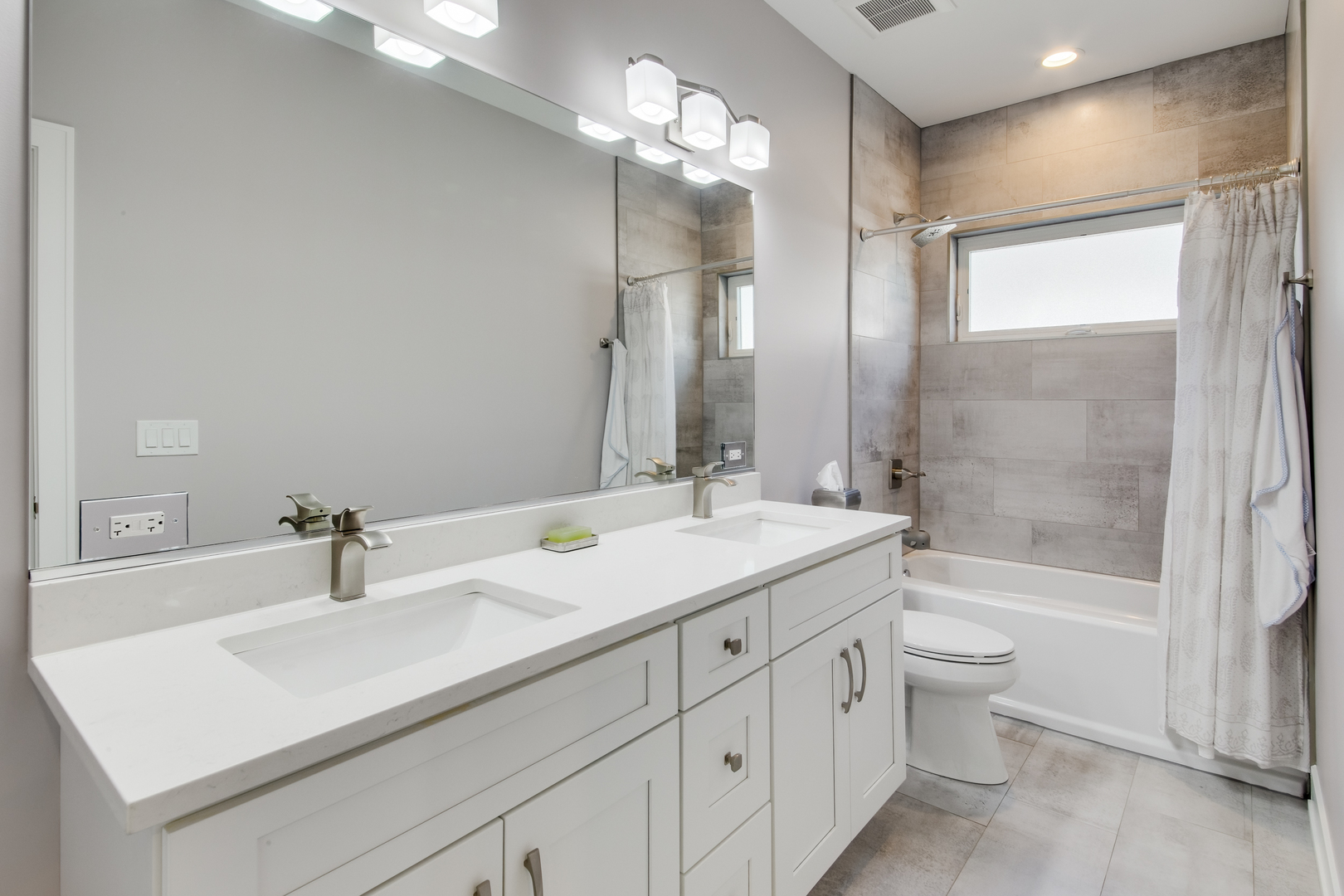 2320 Edna Avenue Park Ridge, IL 60068 - Photo 27 of 41 a bathroom with a sink a toilet and a large mirror