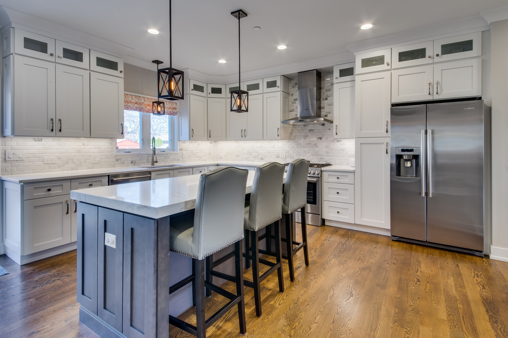 2320 Edna Avenue Park Ridge, IL 60068 - Photo 3 of 41 a kitchen with kitchen island granite countertop a table chairs refrigerator and microwave