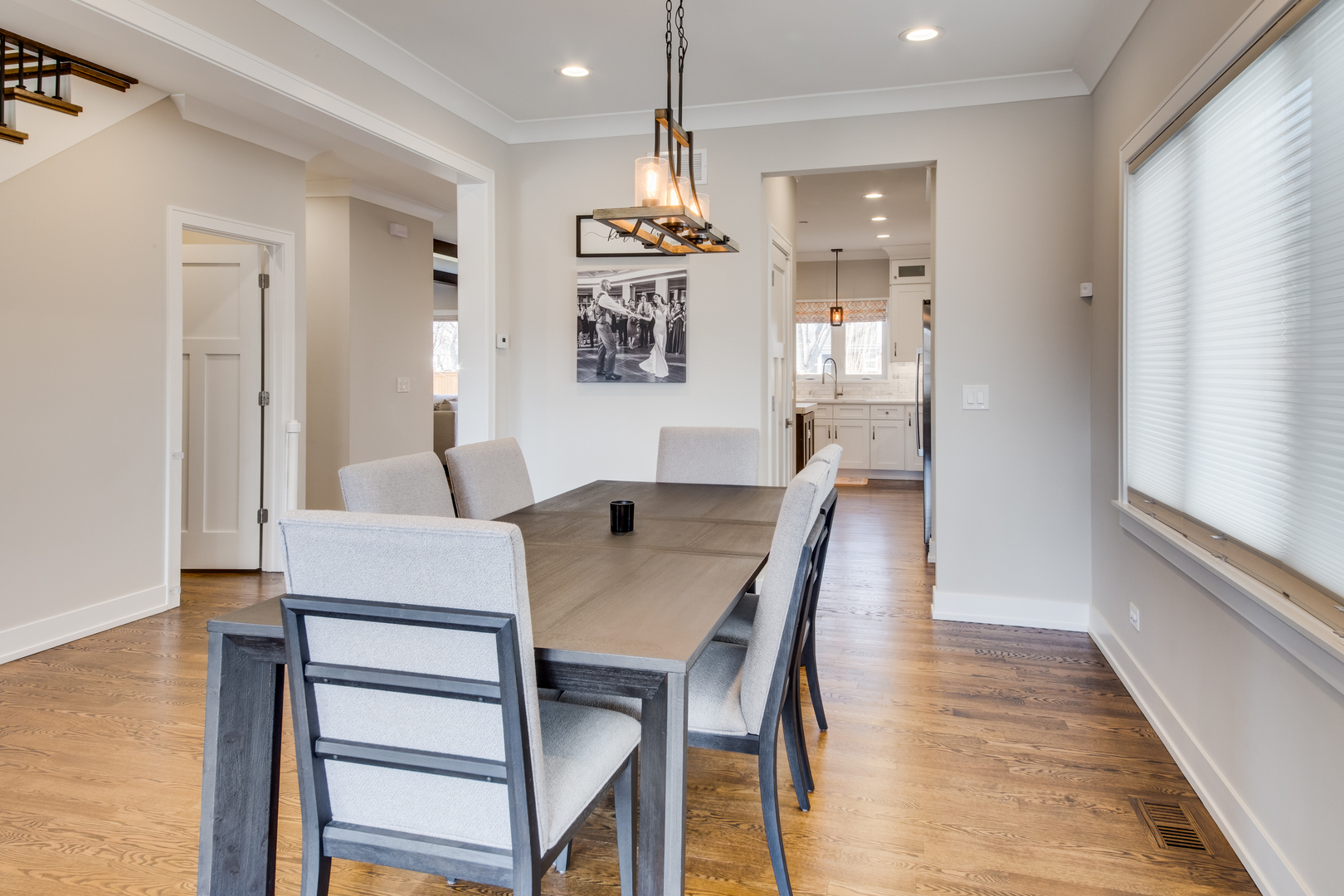 2320 Edna Avenue Park Ridge, IL 60068 - Photo 9 of 41 a dining room with furniture a chandelier and wooden floor