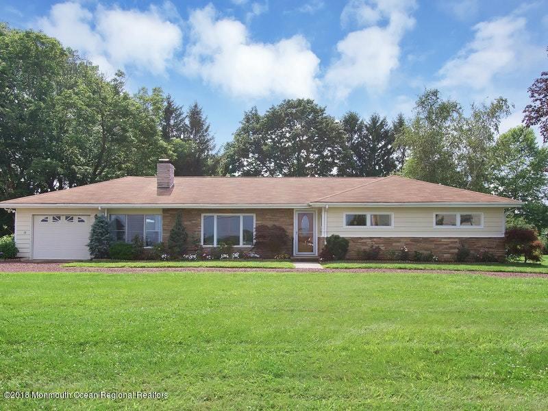 60 Five Points Road Colts Neck, NJ 07722 - Photo 1 of 37 a front view of house with yard and green space
