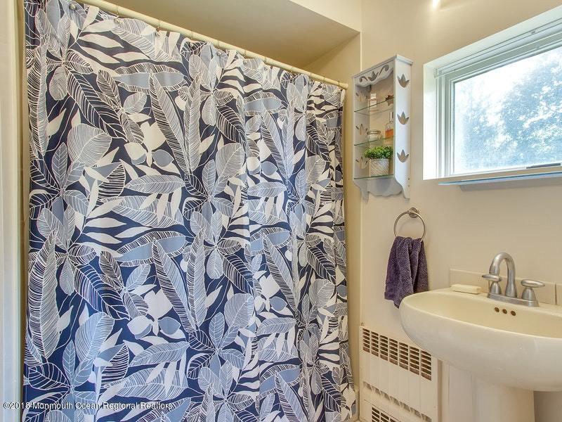 60 Five Points Road Colts Neck, NJ 07722 - Photo 11 of 37 a bathroom with a sink and a mirror