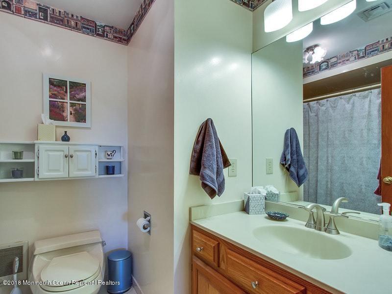 60 Five Points Road Colts Neck, NJ 07722 - Photo 14 of 37 a bathroom with a toilet sink and mirror