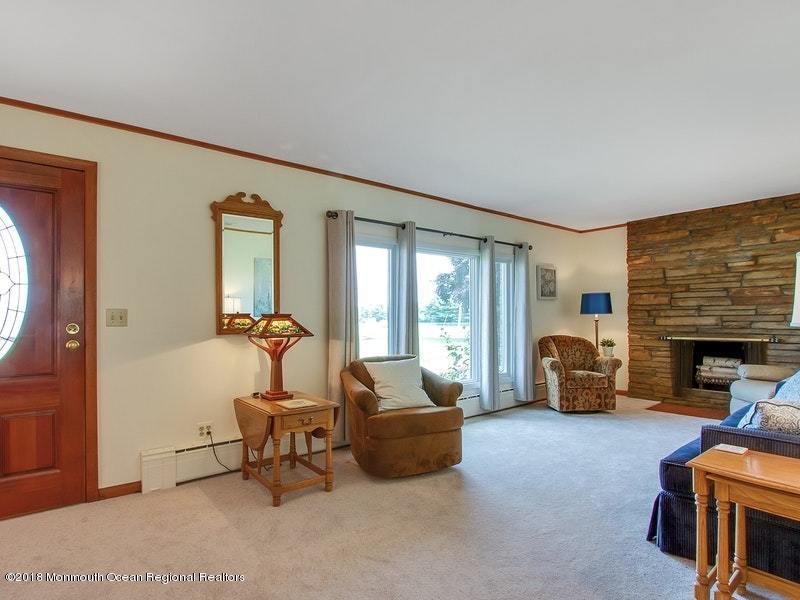 60 Five Points Road Colts Neck, NJ 07722 - Photo 3 of 37 a living room with furniture and a fireplace