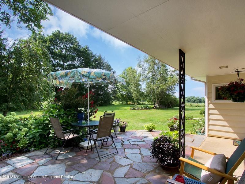 60 Five Points Road Colts Neck, NJ 07722 - Photo 21 of 37 a view of a yard with furniture and garden