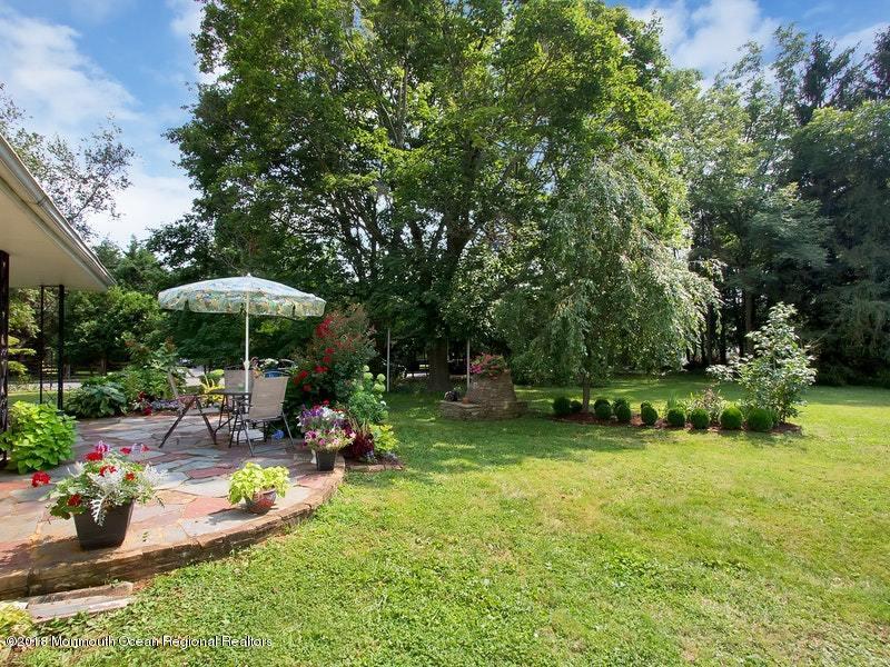 60 Five Points Road Colts Neck, NJ 07722 - Photo 24 of 37 a view of a backyard with plants and chairs