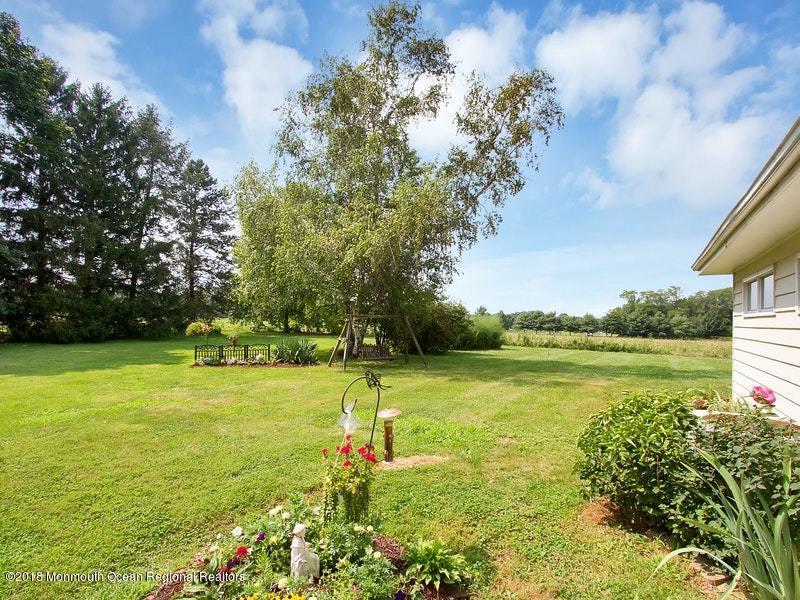 60 Five Points Road Colts Neck, NJ 07722 - Photo 26 of 37 a view of a lake with a big yard