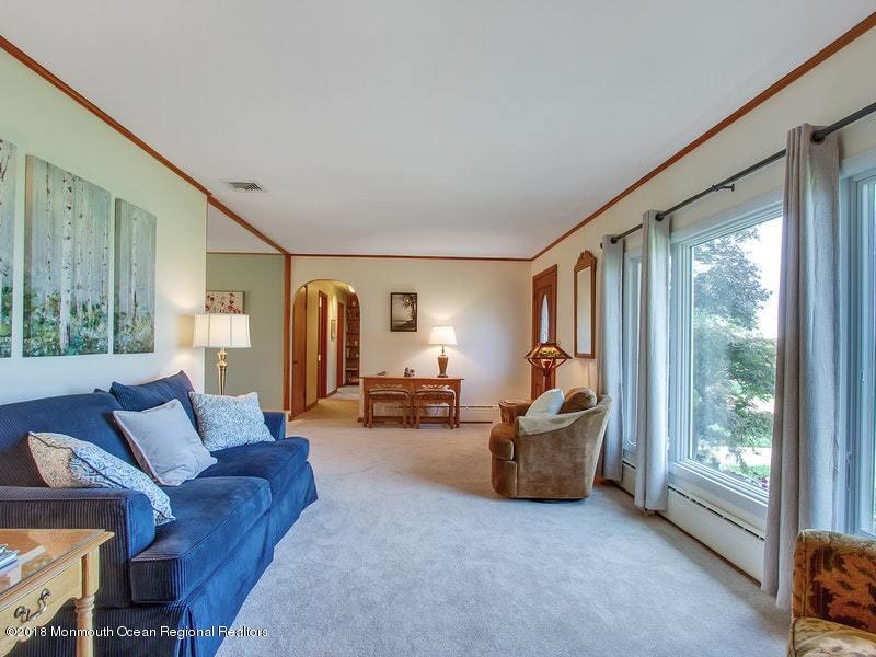 60 Five Points Road Colts Neck, NJ 07722 - Photo 4 of 37 a living room with furniture and a large window