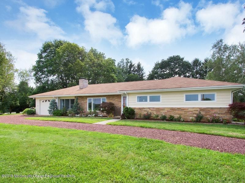 60 Five Points Road Colts Neck, NJ 07722 - Photo 34 of 37 a front view of house with yard and green space