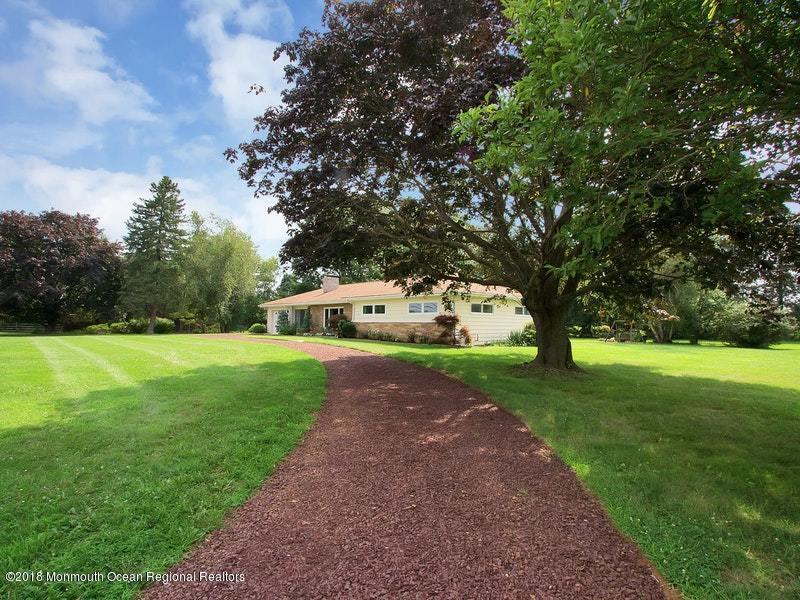60 Five Points Road Colts Neck, NJ 07722 - Photo 35 of 37 a front view of a house with garden