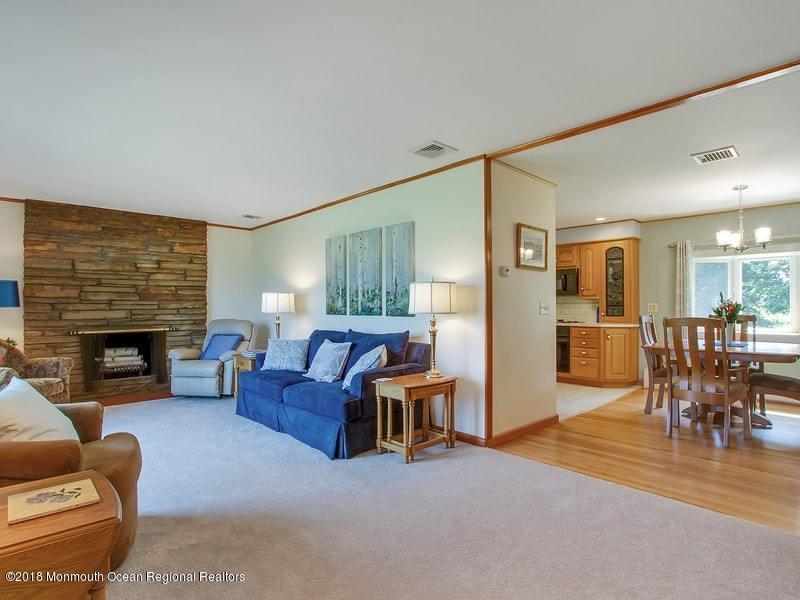 60 Five Points Road Colts Neck, NJ 07722 - Photo 5 of 37 a living room with furniture and a fireplace