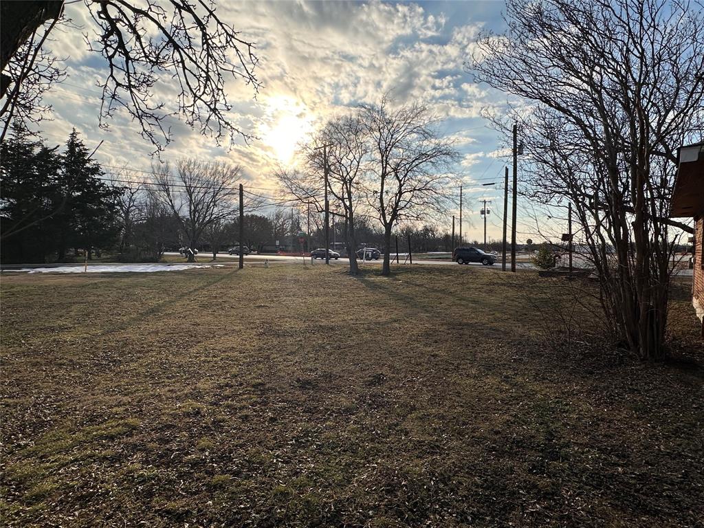a backyard of apartments with large trees