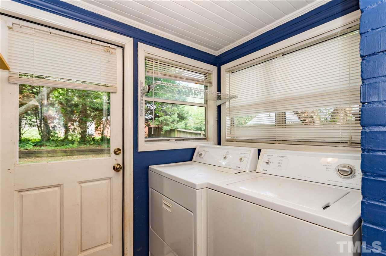 507 Brooks Avenue Raleigh, NC 27607 - Photo 11 of 20 a view of washer and dryer with bathroom in the background