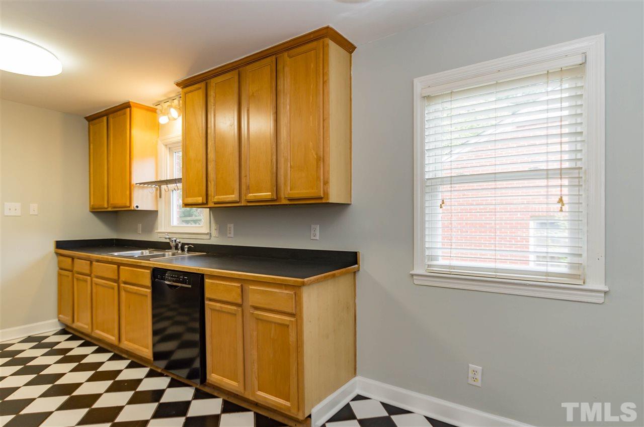 507 Brooks Avenue Raleigh, NC 27607 - Photo 6 of 20 a kitchen with stainless steel appliances granite countertop a sink and a window