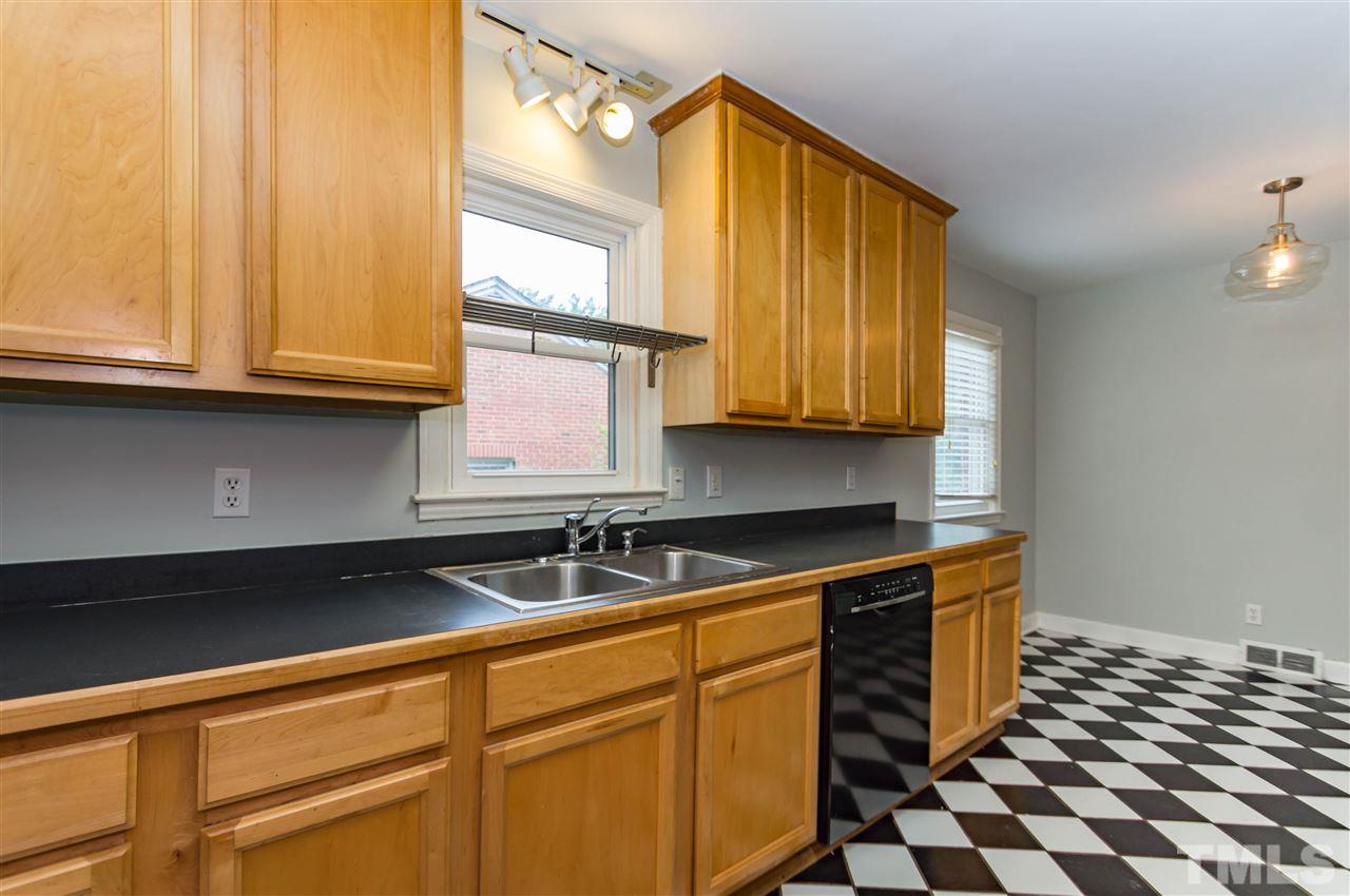 507 Brooks Avenue Raleigh, NC 27607 - Photo 9 of 20 a kitchen with stainless steel appliances a sink and a cabinets
