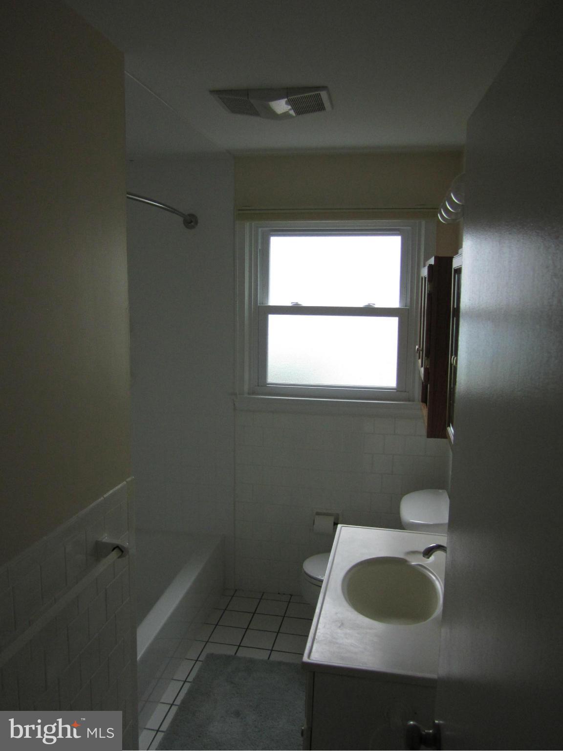 424 West Maple Road Linthicum, MD 21090 - Photo 16 of 24 a bathroom with a sink and a vanity