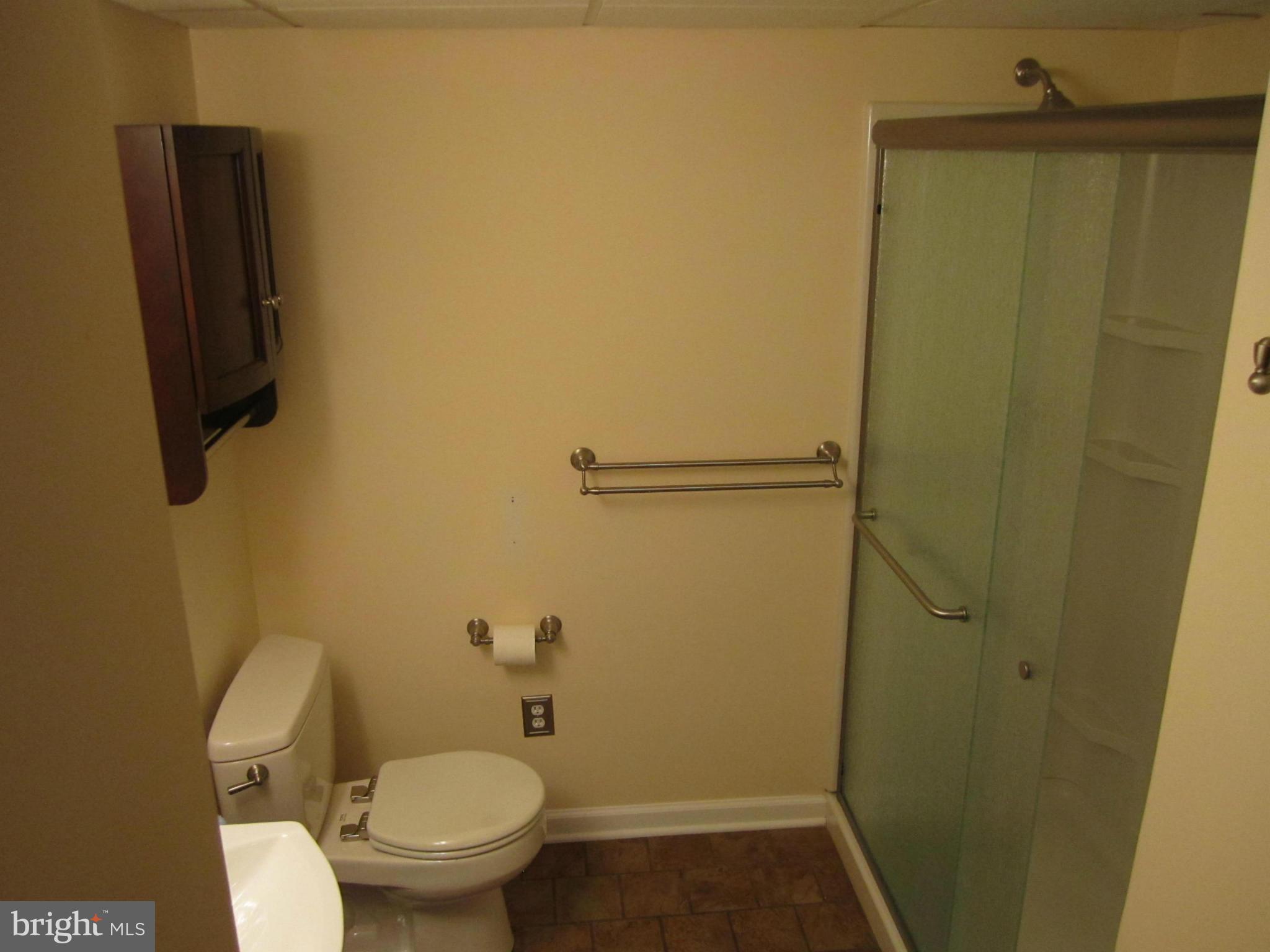 424 West Maple Road Linthicum, MD 21090 - Photo 21 of 24 a bathroom with a toilet and a shower