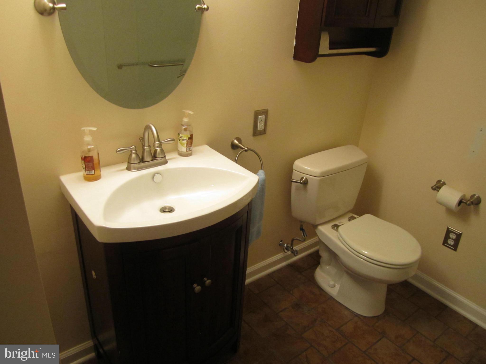 424 West Maple Road Linthicum, MD 21090 - Photo 22 of 24 a bathroom with a sink and a toilet
