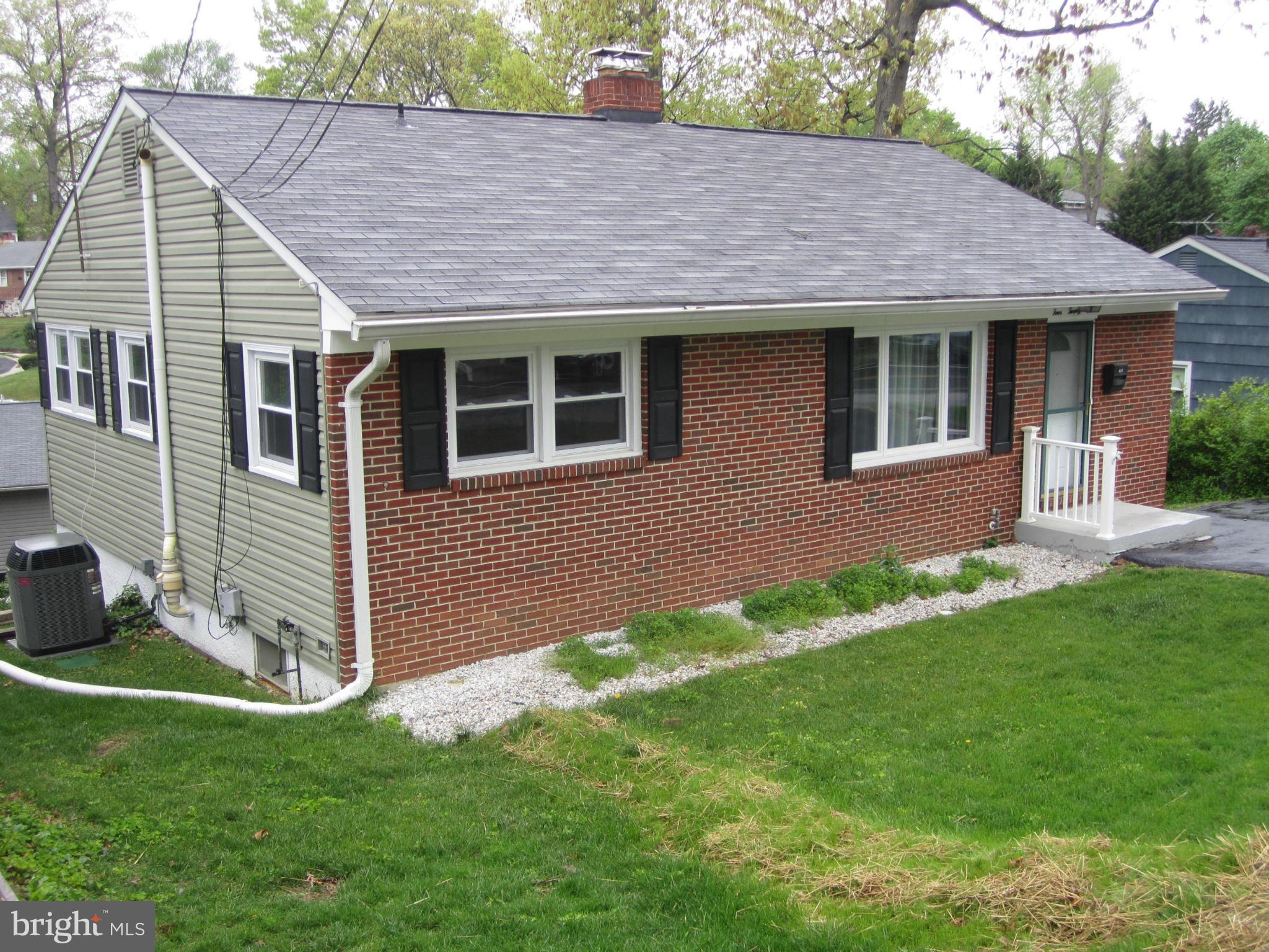 424 West Maple Road Linthicum, MD 21090 - Photo 5 of 24 a view of a house with a yard and sitting area