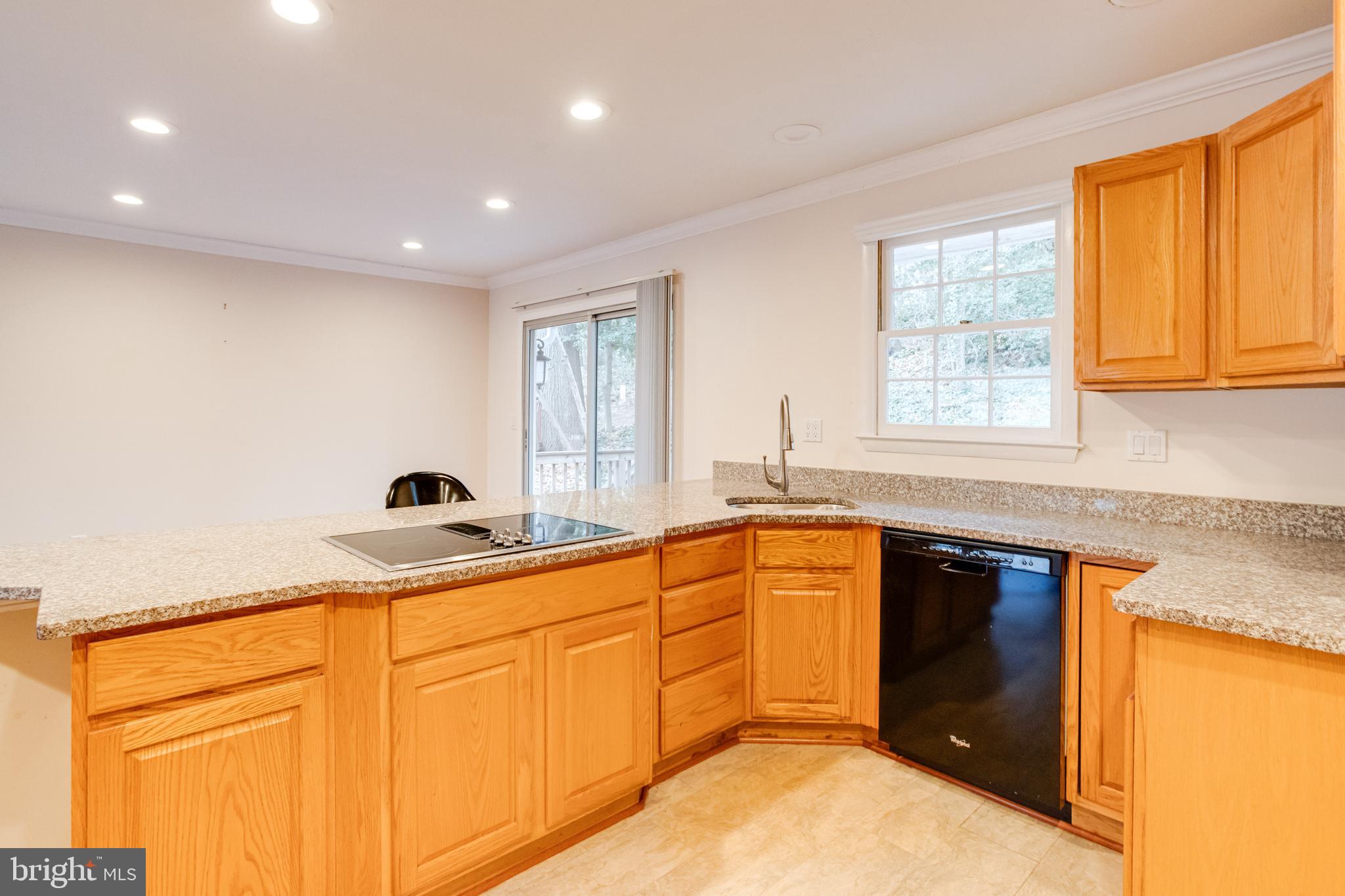 795 Windgate Drive Annapolis, MD 21409 - Photo 13 of 61 a kitchen with granite countertop cabinets sink and window