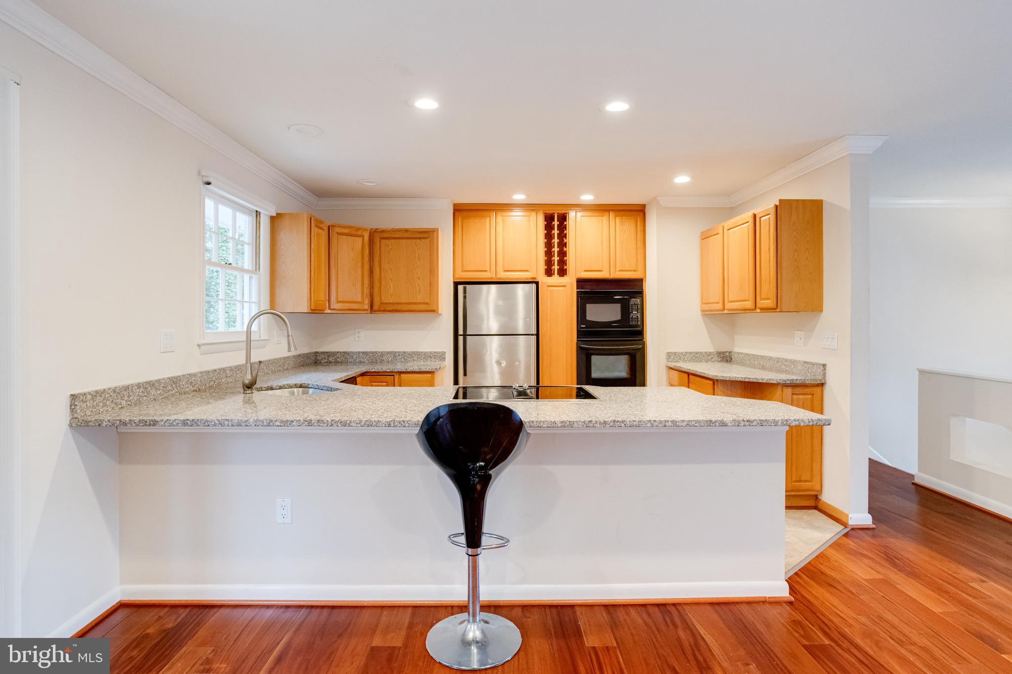 795 Windgate Drive Annapolis, MD 21409 - Photo 15 of 61 a living room with stainless steel appliances granite countertop furniture and a fireplace